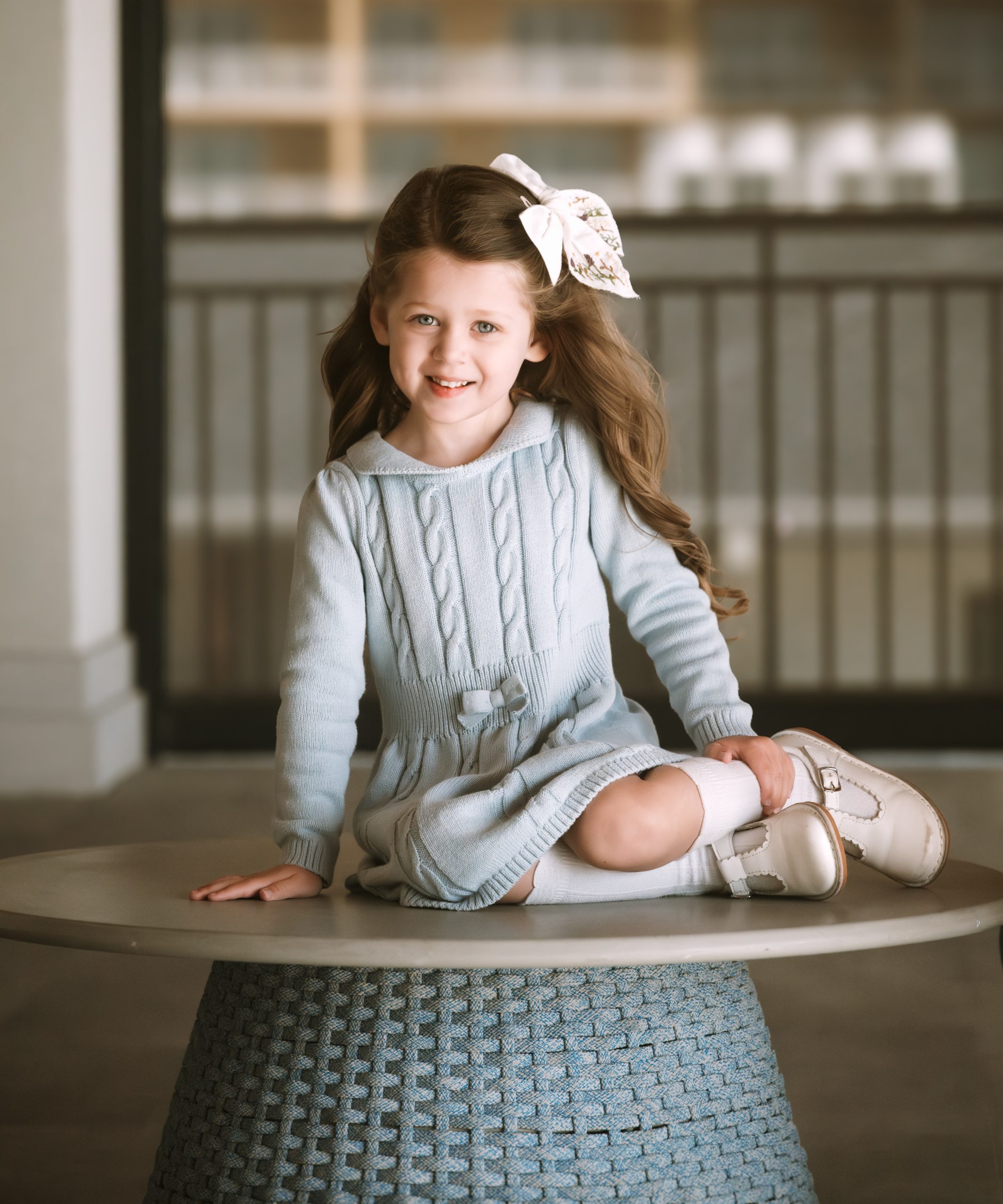 Children's portrait of a smiling girl in a blue dress, fine art photography by Tammy Jaquith in Oregon